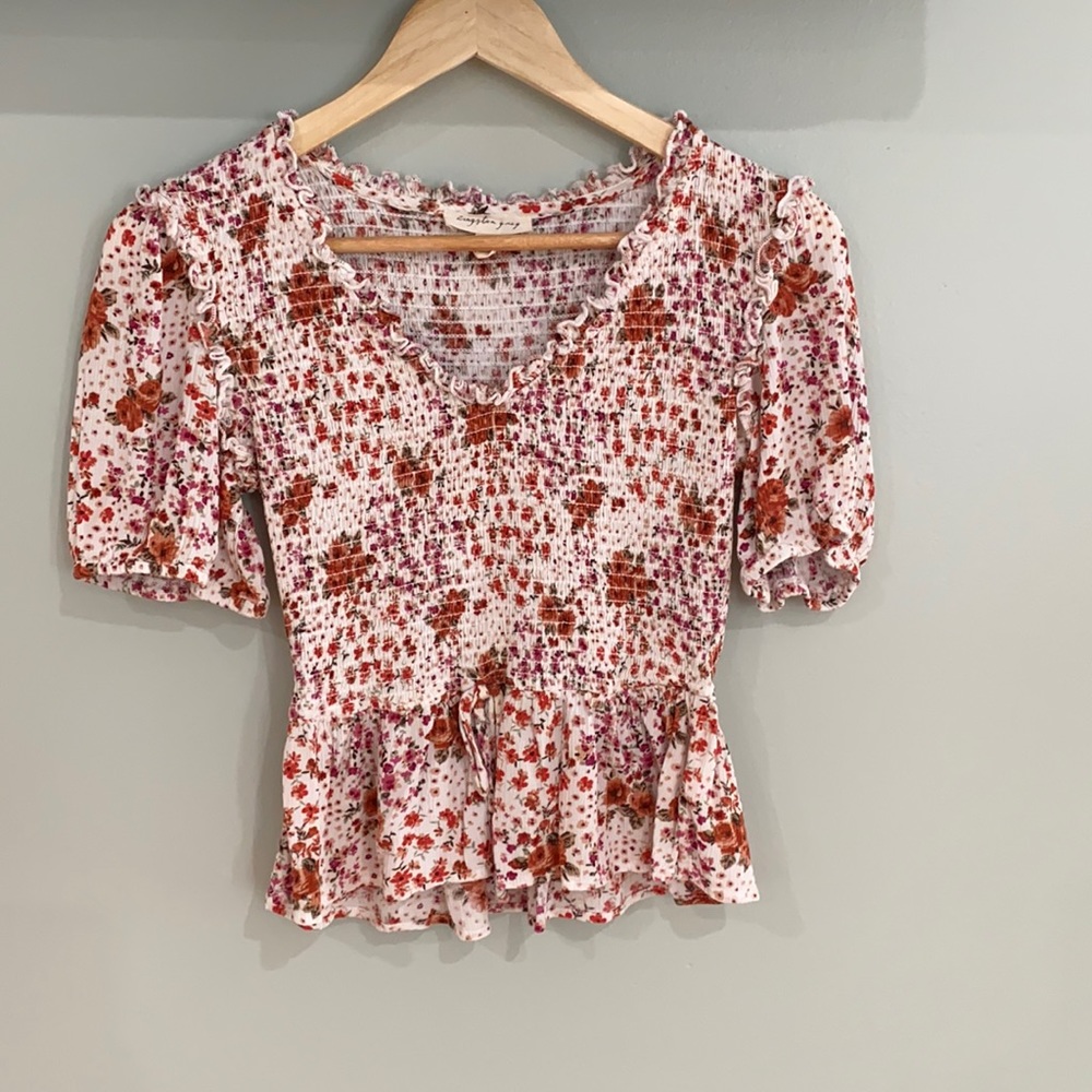 A floral cropped blouse in a size Medium.